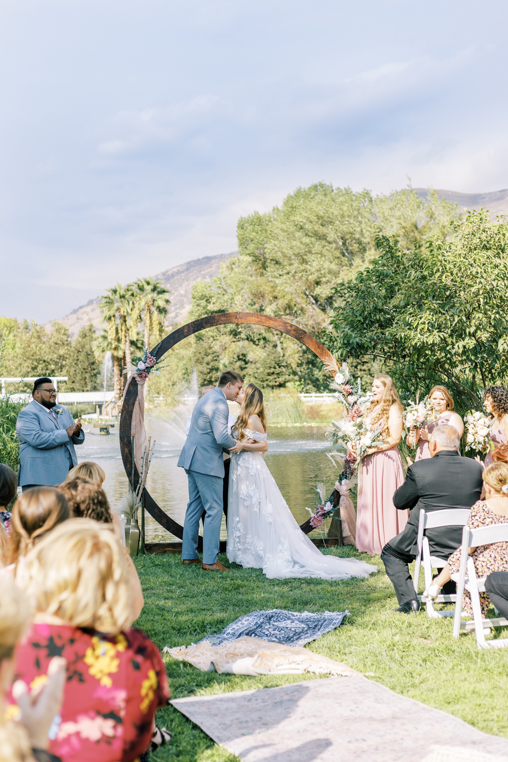 bride and groom first kiss springville ranch wedding ceremony