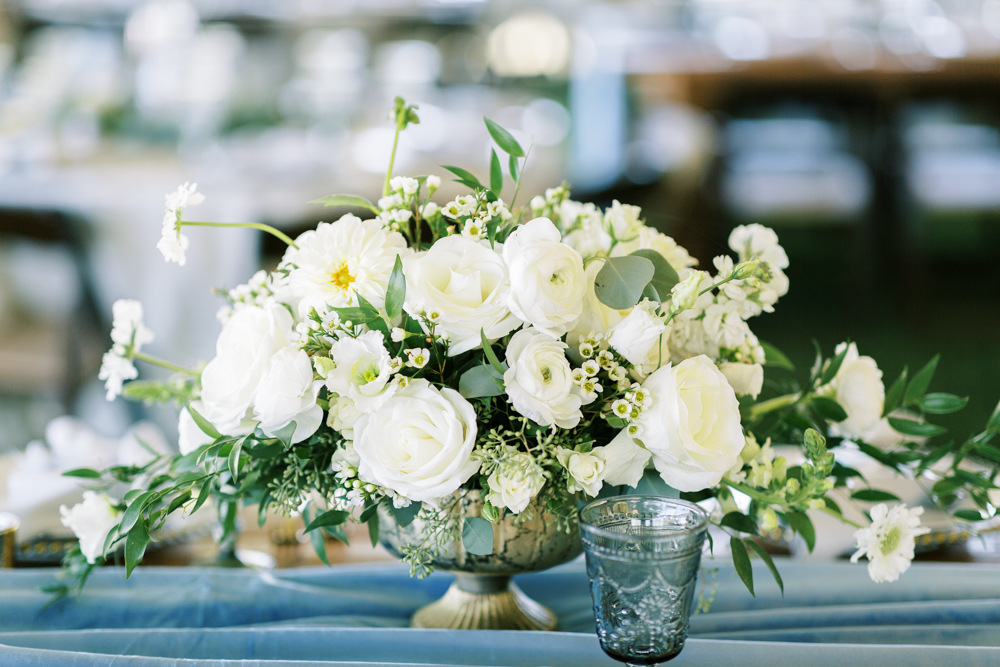 elegant backyard wedding floral arrangement white florals with greenery