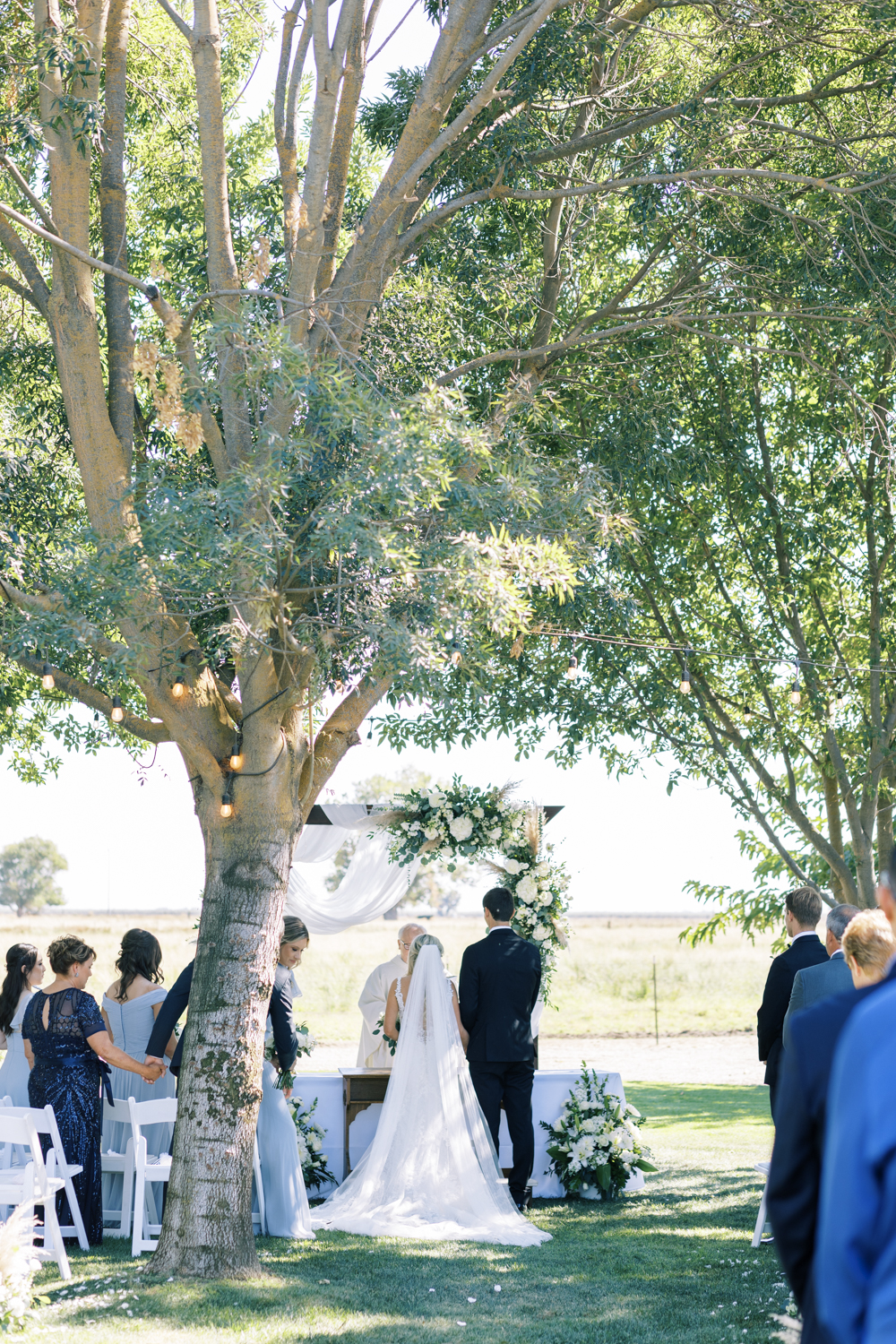 bride and groom standing at altar outdoor catholic wedding ceremony