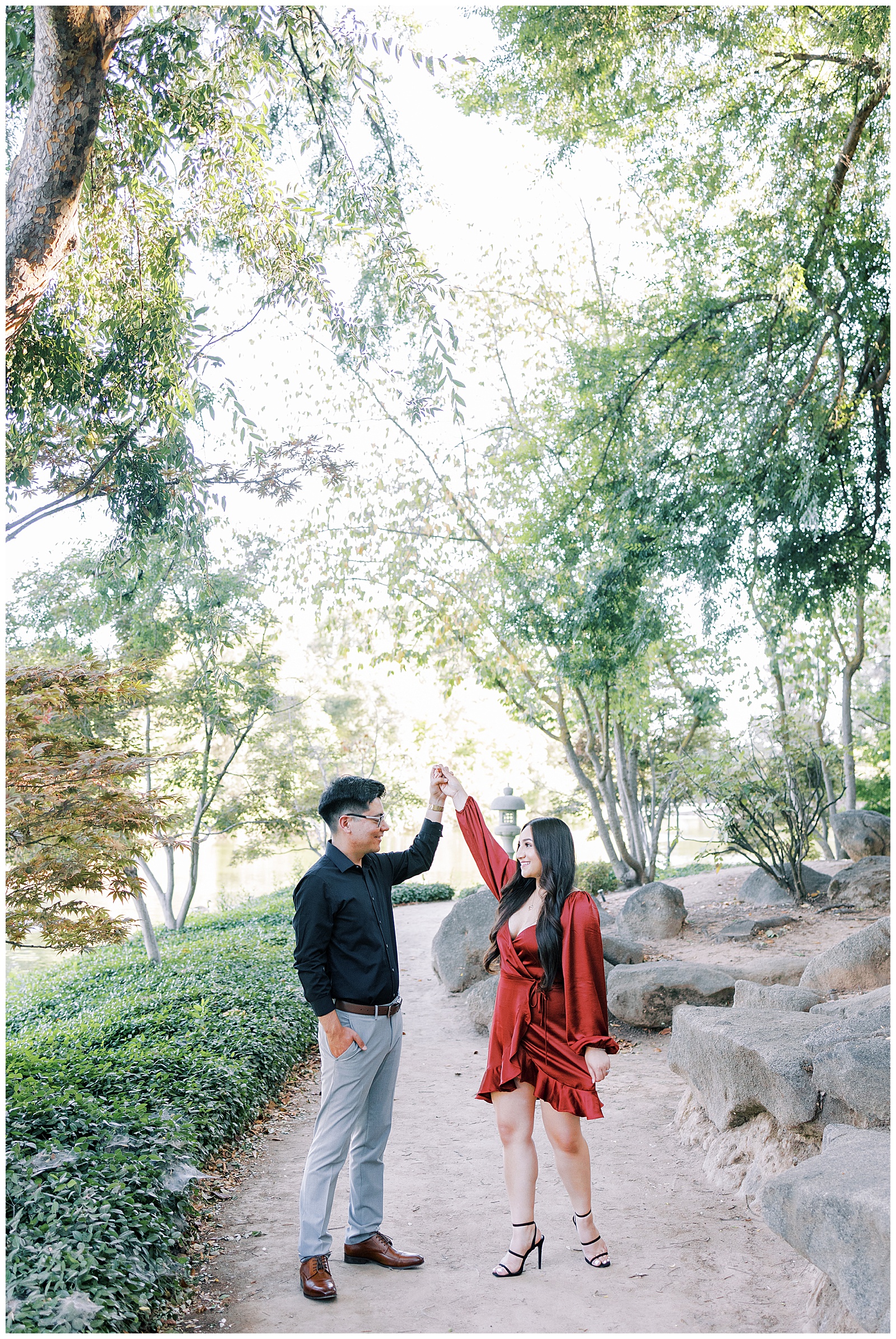 engaged couple dancing under the trees at shinzen japanese gardens