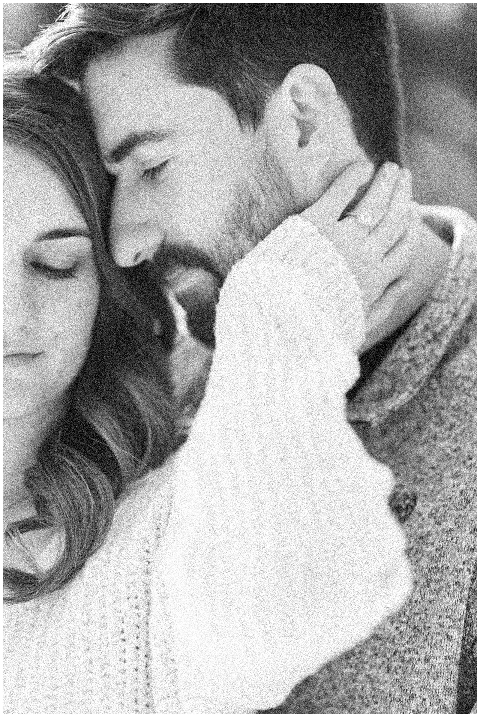 close up couple embracing black and white grainy
