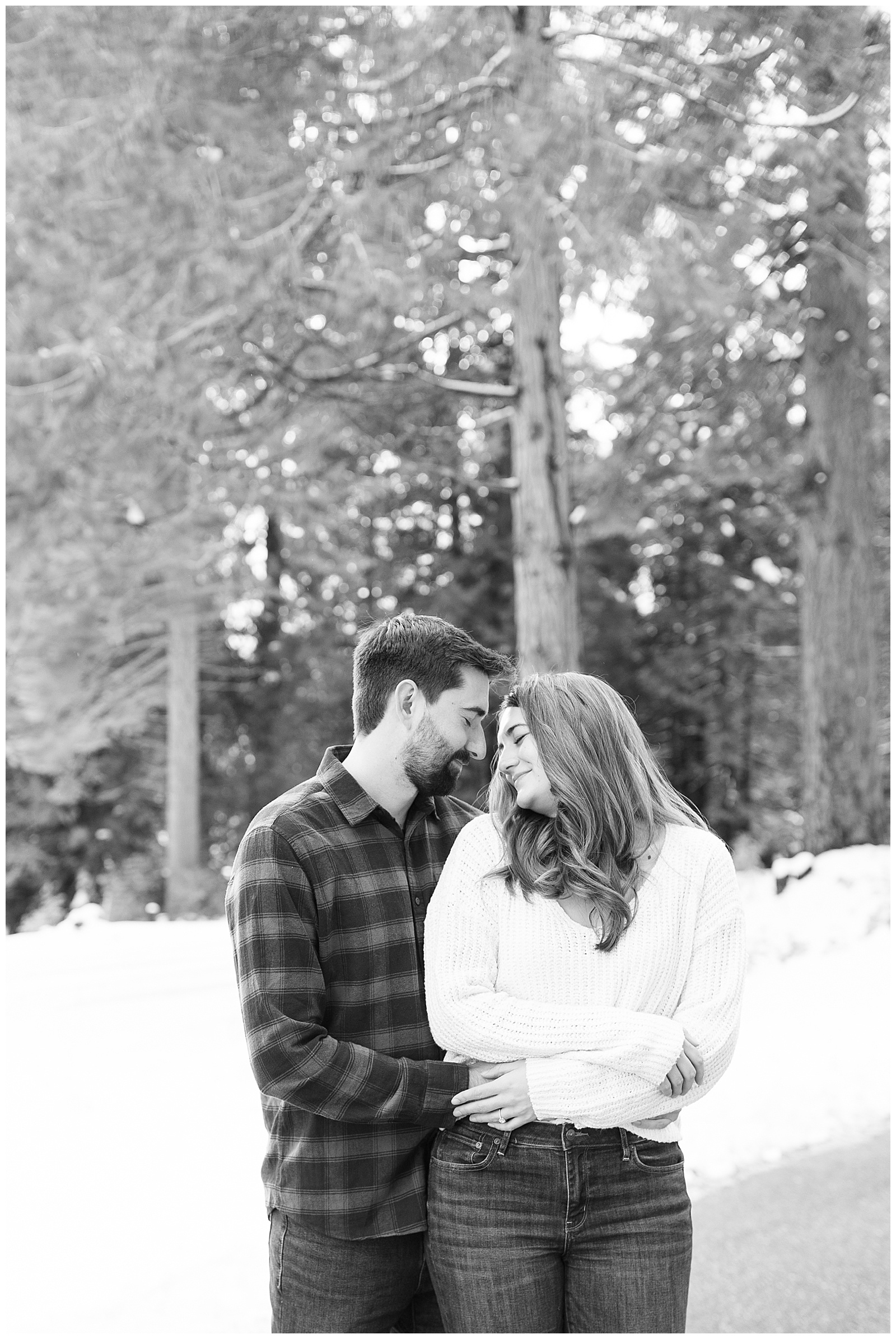 black and white couple embracing eyes closed cozy engagement photos