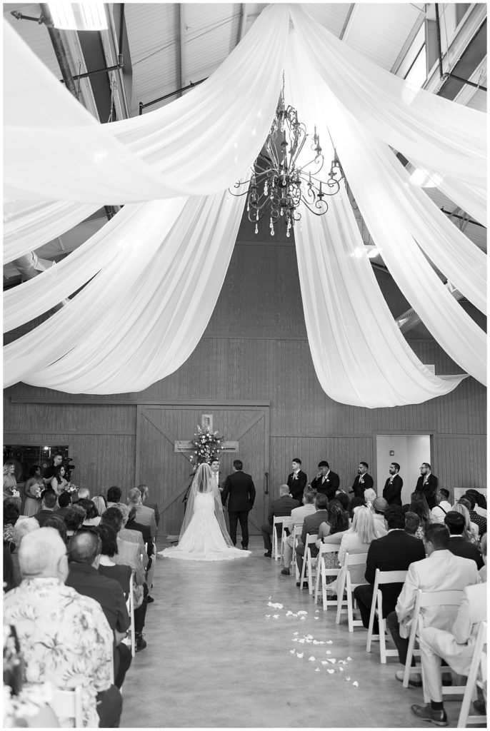 black and white image of indoor wedding ceremony