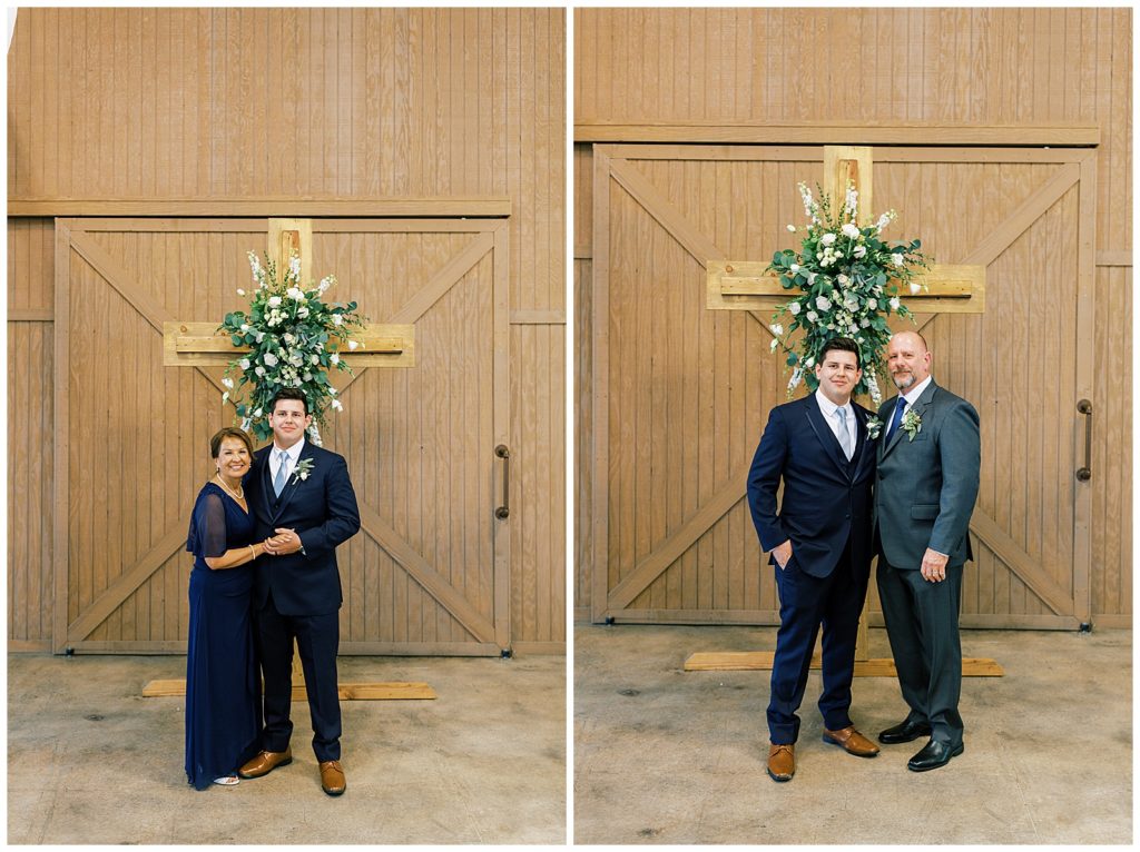 groom formal wedding photos with his parents in front of wooden cross 