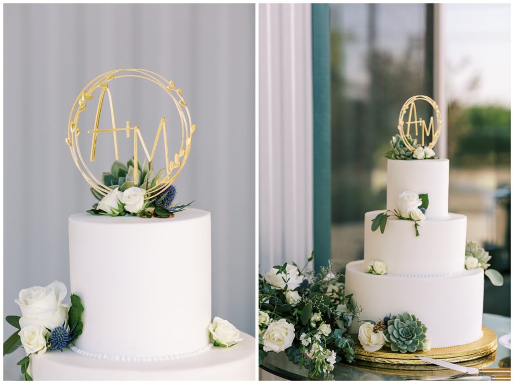 minimalistic white wedding cake with succulents and golden monogram cake topper